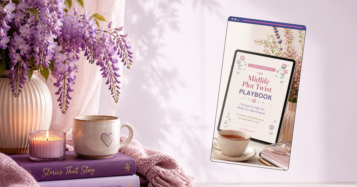 Soft lilac-toned desk scene with an open laptop showing an email inbox, stacked pastel books, a lavender mug, candle and wisteria flowers, created for Susie’s News author newsletter sign-up