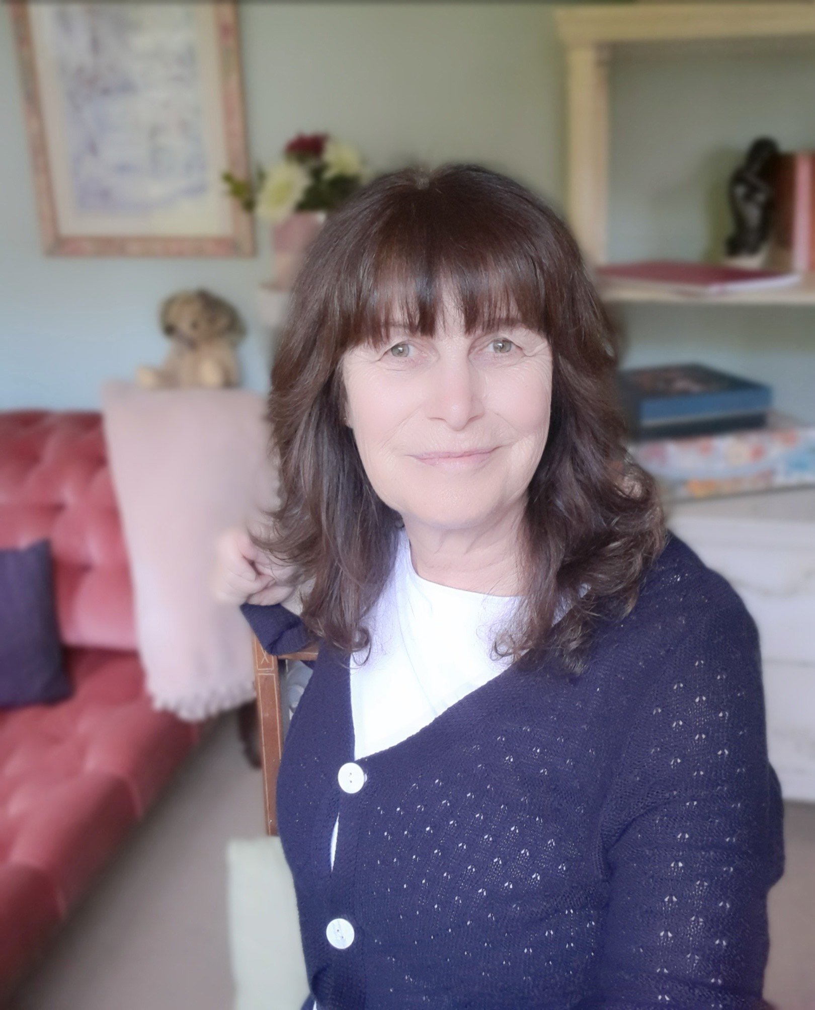 Photo of susie Sharp sitting by the lake