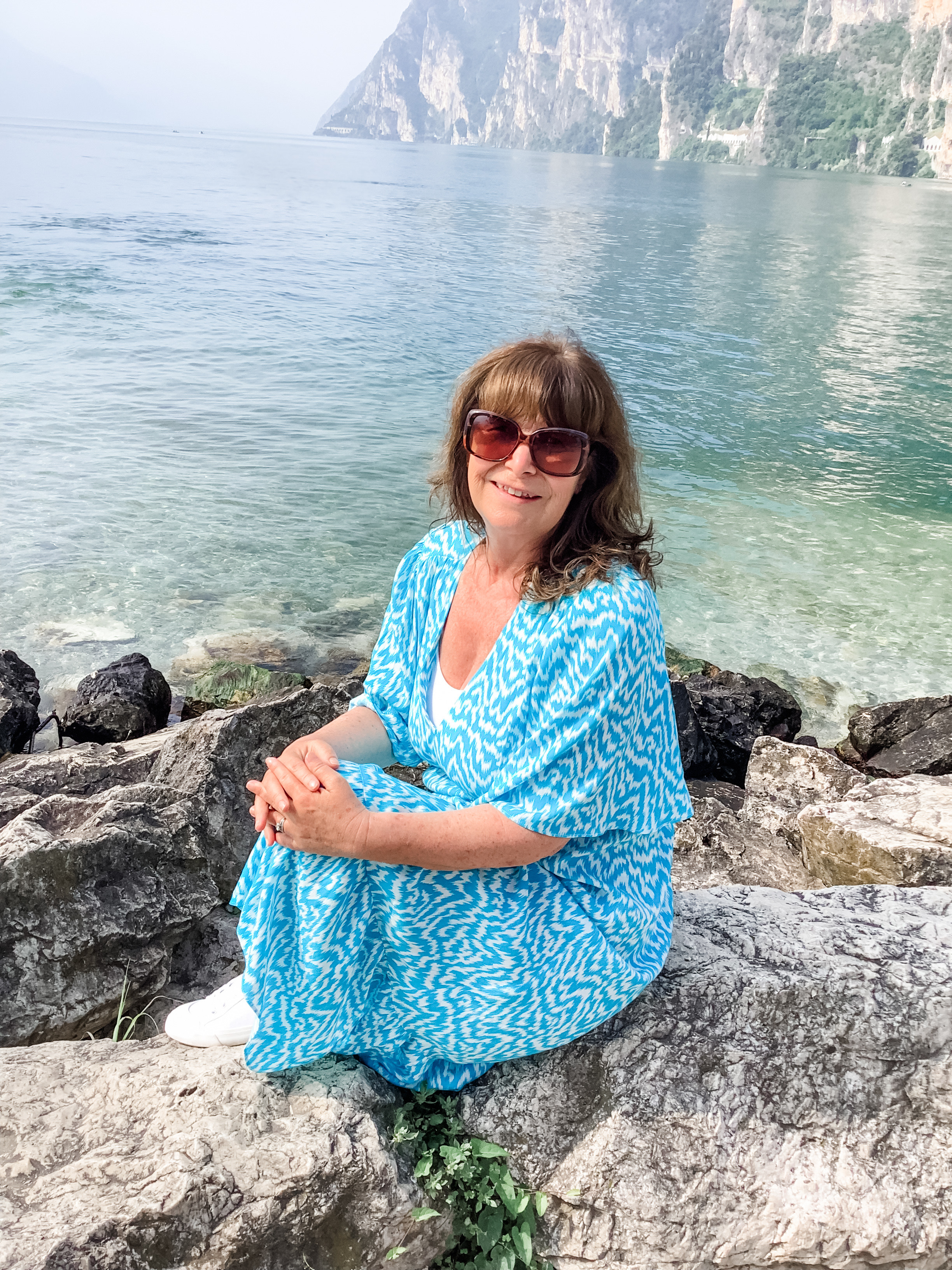 Photo of susie Sharp sitting by the lake